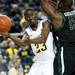 Michigan freshman Caris LeVert passes under the rim in the first half of the game against Binghamton on Tuesday. Daniel Brenner I AnnArbor.com